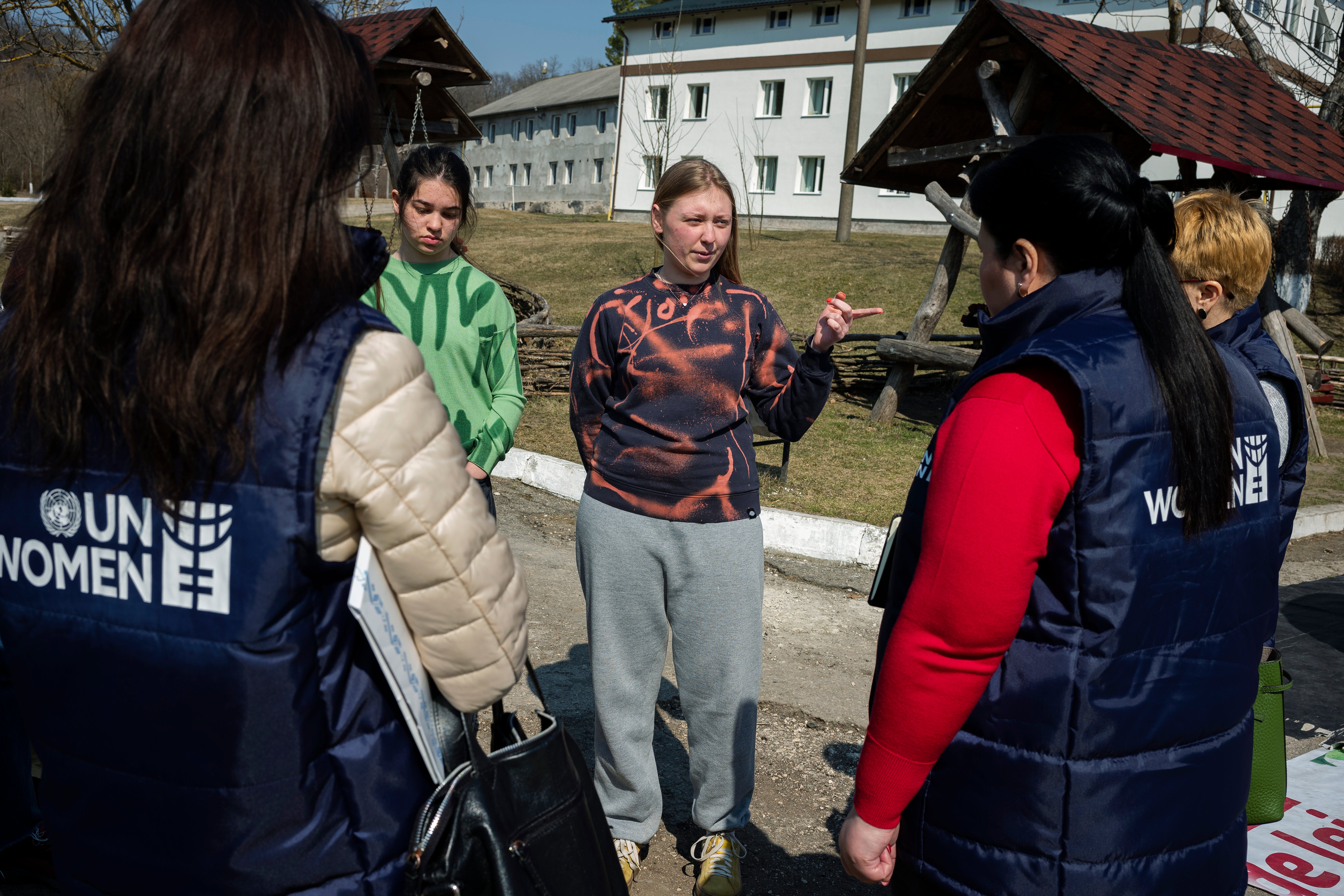 23-year-old Anna, from Mariupol, discussing with UN Women team at the temporary placement center in Vatici, Orhei district, Moldova. Photo credit: Maxime Fossat / UN Women