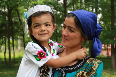 Photo 2:  Happy and empowered Latofat and her daughter. Photo: UN Women/Aijamal Duishebaeva