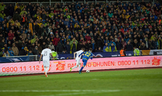 Campaign slogans on pitchside LED billboards during match. Photo: UN Kosovo Team