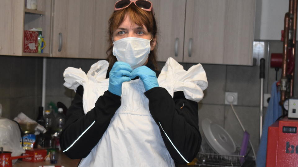 With full personal protective equipment, Snezana Zivadinovic travelled during COVID-19 pandemic to numerous villages in central Serbia advocating for an equal distribution of care and domestic work. Photo courtesy of Society for the Development of Creativity