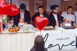 Members of the Made with Love team sell baked goods made by survivors of violence. UN Women/Ina Cenko