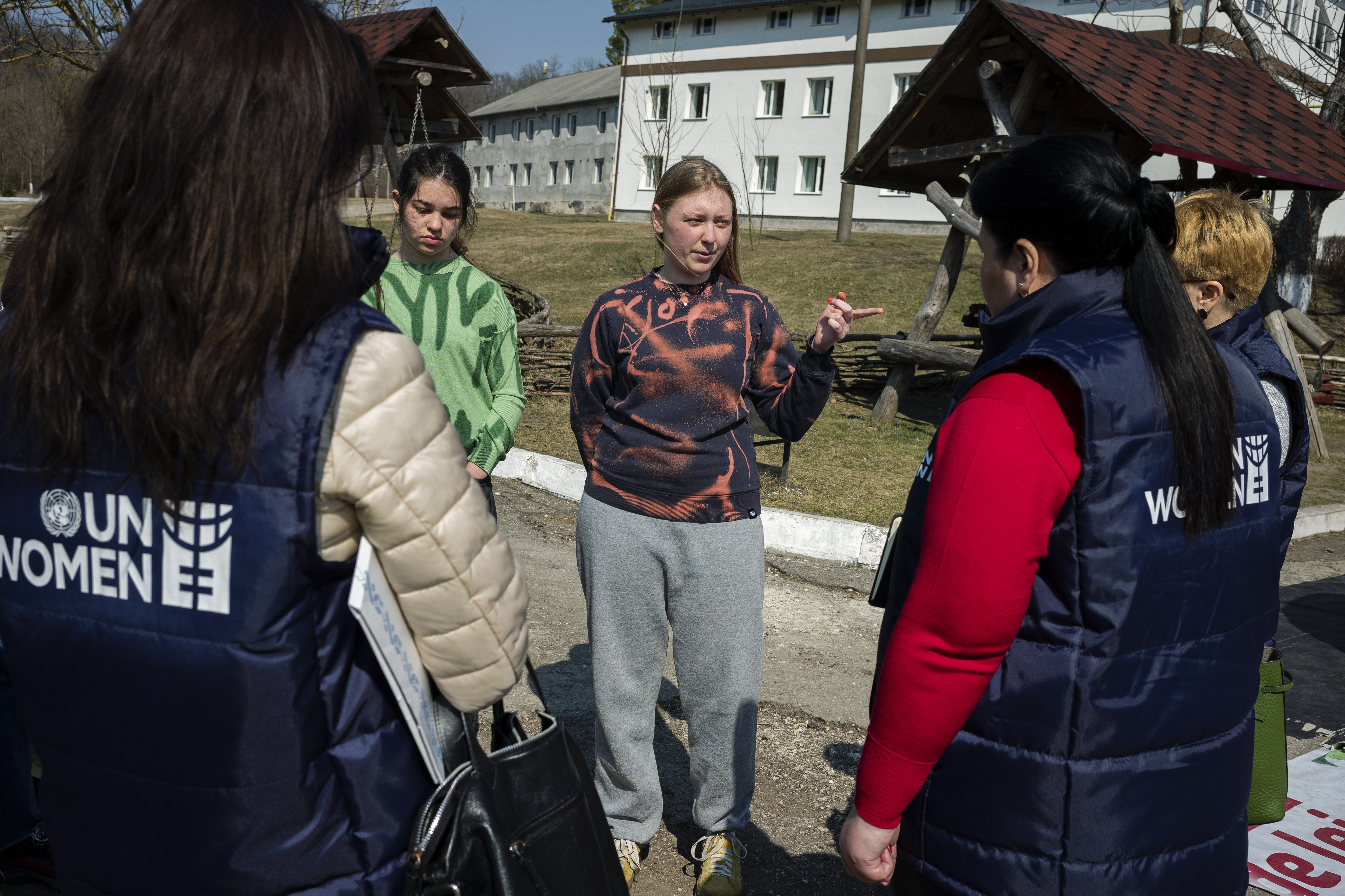 23-year-old Anna, from Mariupol, discussing with UN Women team at the temporary placement center in Vatici, Orhei district, Moldova. Photo credit: Maxime Fossat / UN Women