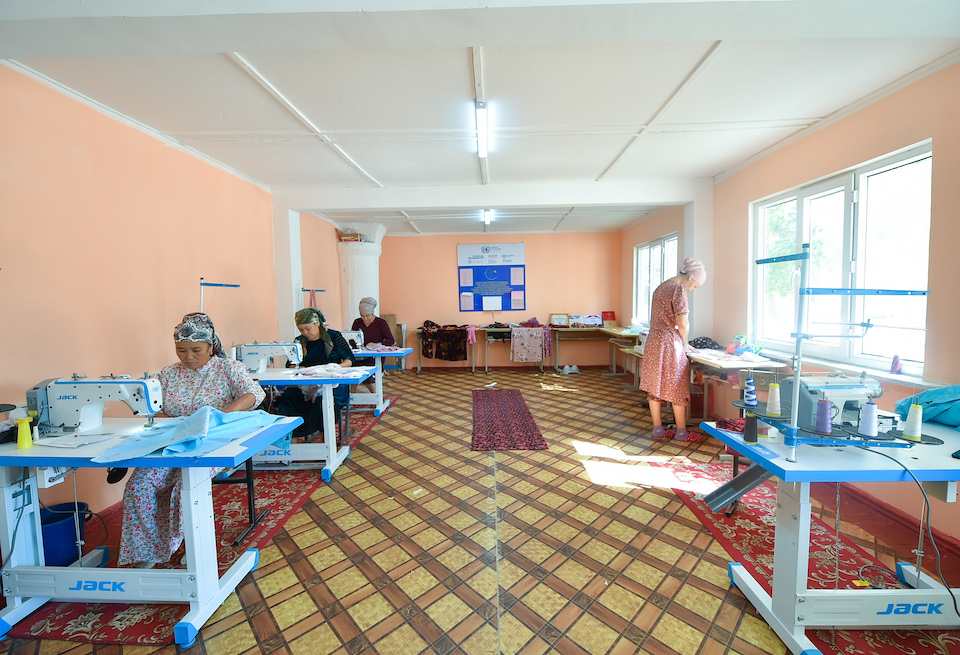 Danakhan (front right) working in the old school building that serves now as a sewing shop and training centre. Photo: UN Women/Alisher Aliev.