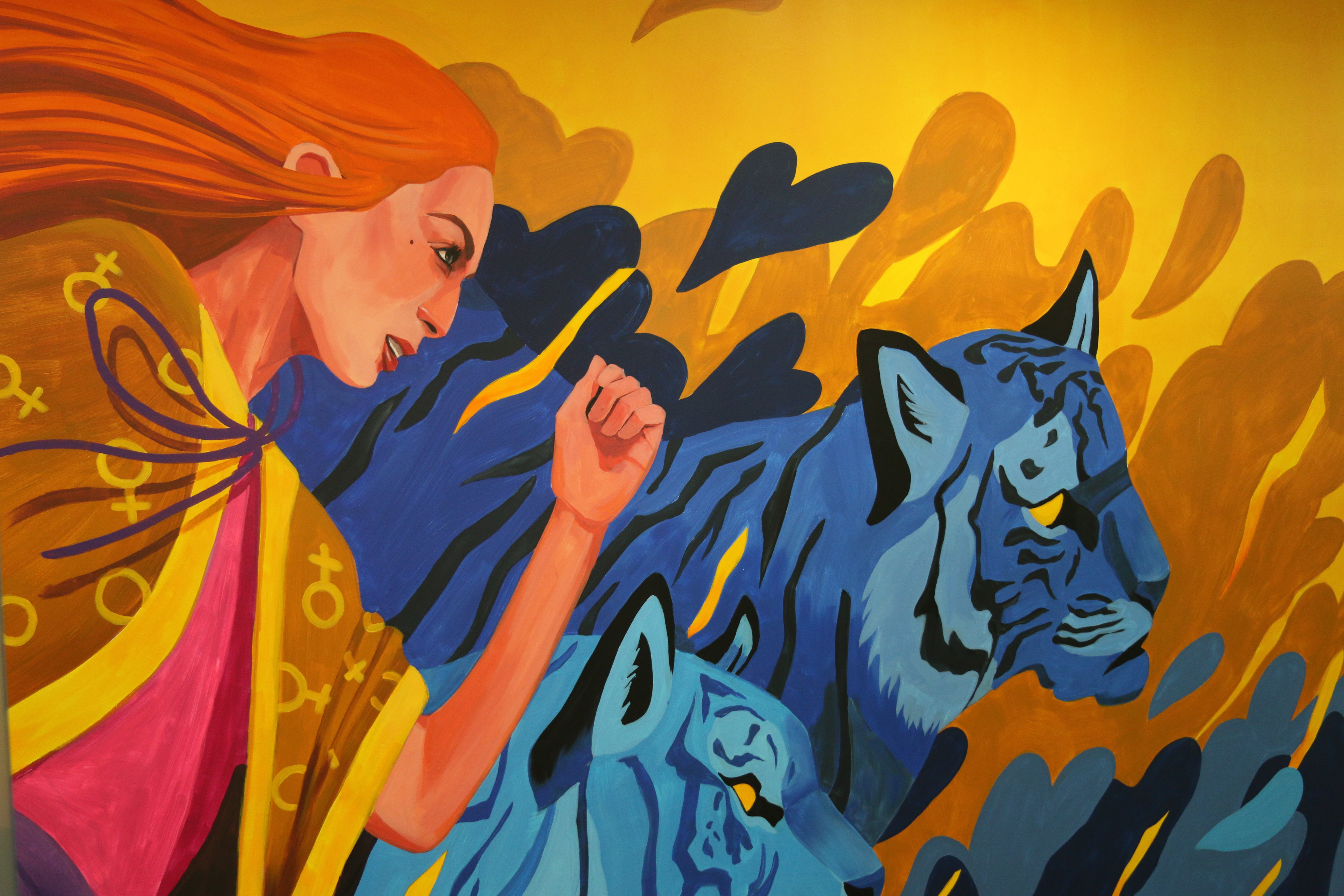 Mural illustrating a strong woman figure accompanied by tigers - one of the fiercest animals on earth - rushing towards an equal world, illustrated by Nataša Konjević. Photo: UN Women