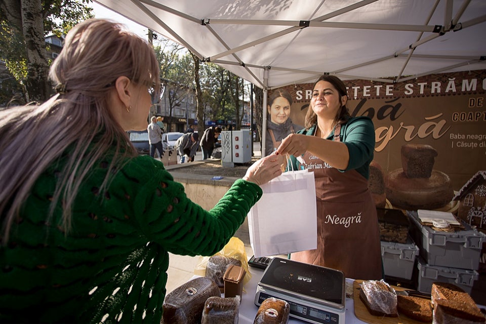 Mariana Zabrian, a local female producer of 'baba neagra,' a traditional Moldovan dessert.