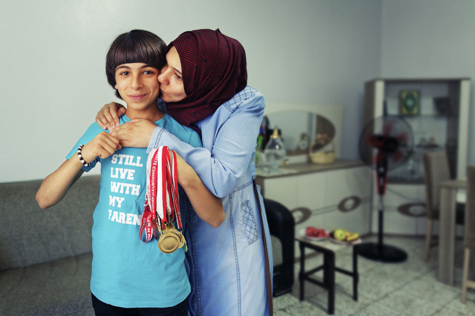One of Delal’s children, Muhammed Emin holds medals he earned at different Kung fu competitions in Turkey and Syria. All her children are fluent in Turkish and well-integrated into the society. Photo: UN Women/ Tayfun Dalkılıç 