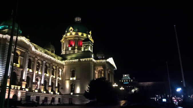 The Serbian Parliament in Belgrade, Serbia, lit orange. Photo: UN Women/Bojana Barlovac