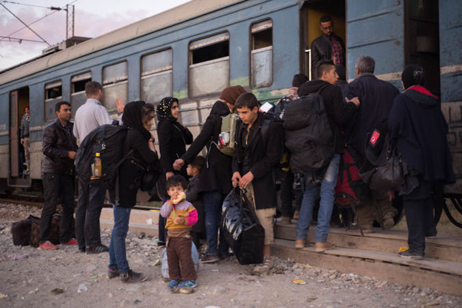 Refugees getting ready for the train in Gevgelija to travel to the border with Serbia, photo credit: Mirjana Nedeva