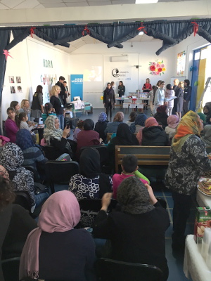 More than 100 women refugees and migrants came to the opening of the Women's Center to learn about new activities and apply for those they wish to attend. Photo: UN Women/Bojana Barlovac