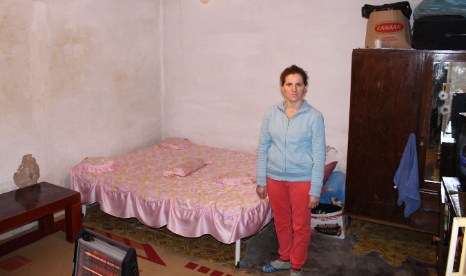 Semiha Xhani in her 20 square meter room with one window. Photo: UN Women/Yllka Parllaku
