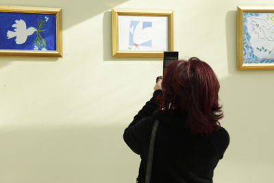 Photographer capturing the artworks on camera. Photo: UN Women