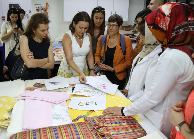Donors and partners are briefed about textile production at the SADA Women-only Centre. Photo: Serenas Tourism 