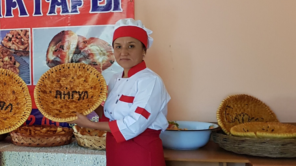 As a self-help group member in Arka village, Janyjer municipality, Gulyaim Dobutova provides bakery services. 