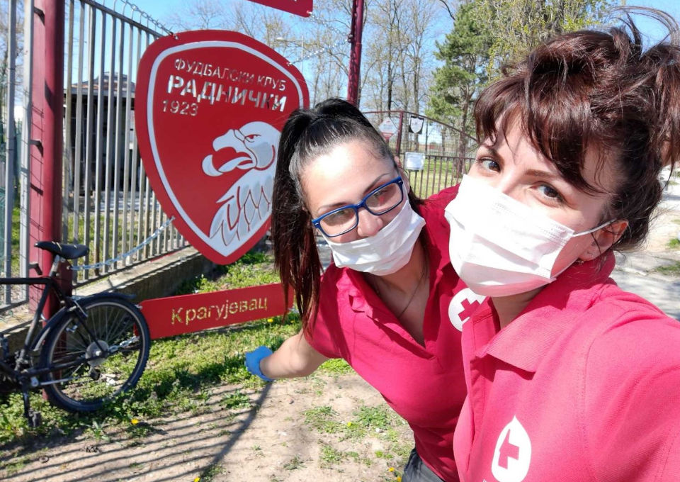 Red Cross volunteer Marijana Karajovic (on the left) and her team member are on their way to distribute humanitarian and hygiene kits. Photo courtesy of Red Cross
