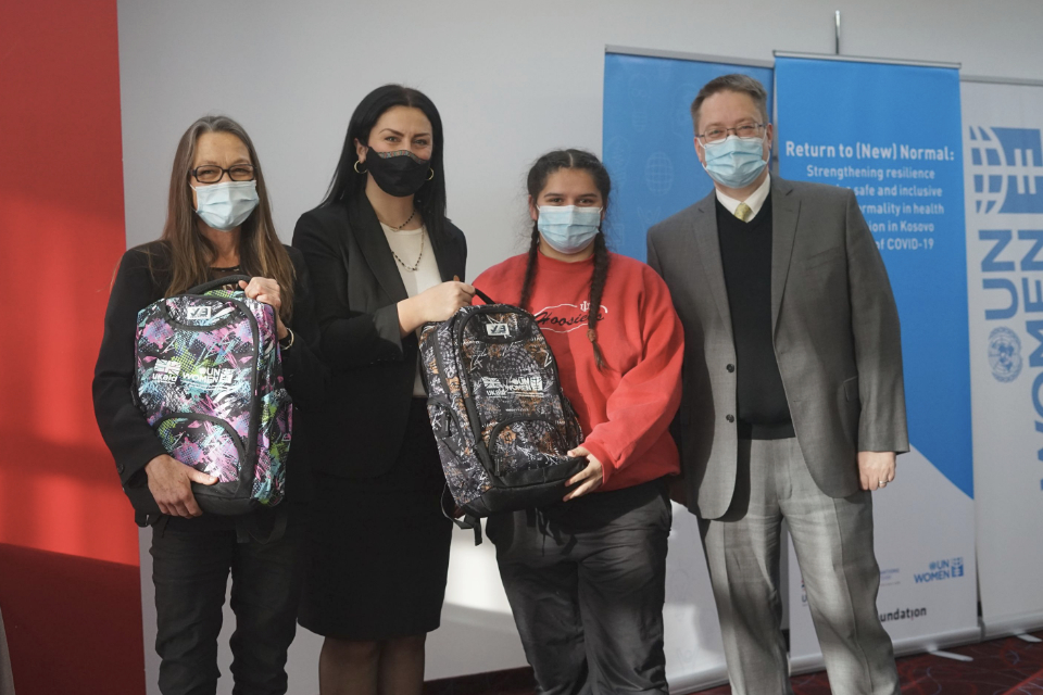 British Ambassador to Kosovo, Nicholas Abbott; UN Development Coordinator, Ulrika Richardson, and UN Women Head of Office, Vlora Tuzi Nushi, pictured with a young woman from Roma, Ashkali and Egyptian communities who received a laptop to facilitate her online learning. Photo: UN Women