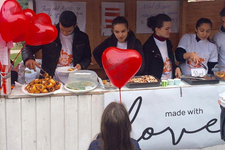 Members of the Made with Love team sell baked goods made by survivors of violence. UN Women/Ina Cenko