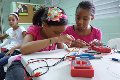 Female adolescents and girls as young as 11 years old are taking classes in robotics, auto-mechanics, computer programing and electronics.