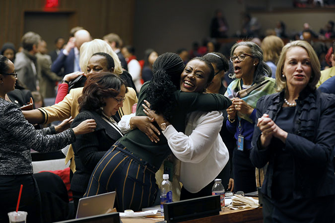 Participants at the 62nd session of the UN Commission on the Status of Women rejoice as the Commission adopts Agreed Conclusions to ensure the rights and development of rural women and girls. Photo: UN Women/Ryan Brown
