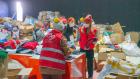Female TOG volunteers coordinate operations at a storage unit in Hatay