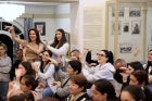 Participants of the theatre performance learn how to sing in sign language. 