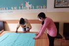 Current and former beneficiaries of women's shelter in Sombor, Serbia, got together to use their skills to contribute to COVID-19 response in their local community. They are sewing protective masks for taxi drivers driving healthcare workers and represent