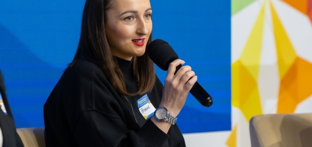 Evghenia Hutsuleac shares insights from her journey as a WoW programme beneficiary during the final event of the project "Strengthening the socioeconomic resilience of women and girls affected by the Ukrainian refugee crisis in Moldova." Photo credit: UN Women Moldova